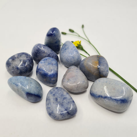 Blue Quartz Tumbled Stone showcasing smooth, polished crystals in soft blue hues, known for their ability to promote clarity, enhance intuition, and support emotional healing.