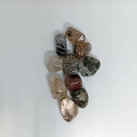 Garden Quartz Tumbled Stone showcasing smooth, polished crystals with garden-like inclusions, known for their ability to promote healing, growth, and emotional clarity.