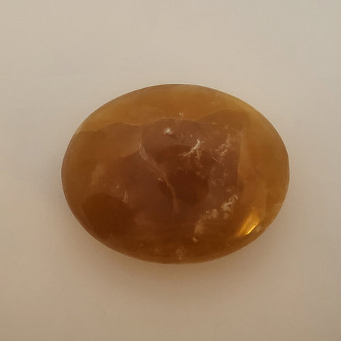 Smooth and Polished Honey Calcite Palm Stone for Empowerment and Confidence