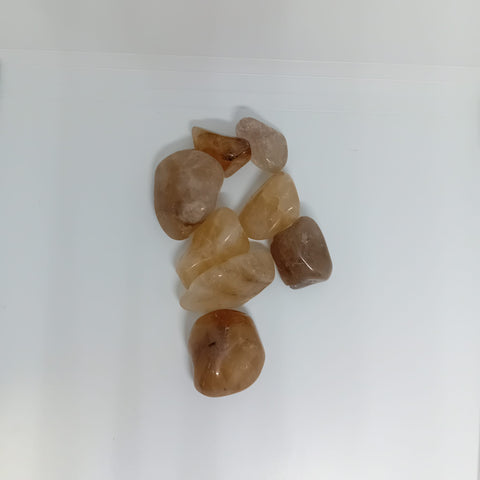 Kundalini Citrine Tumbled Stone showcasing smooth, polished crystals in vibrant golden hues, known for their ability to enhance energy flow, spiritual awakening, and personal power.