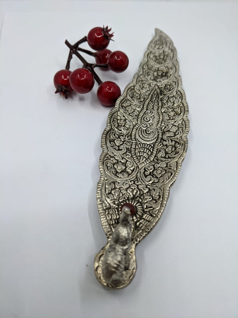 Elephant Incense Burner with a metal finish and gem detailing, designed for securely holding incense sticks.