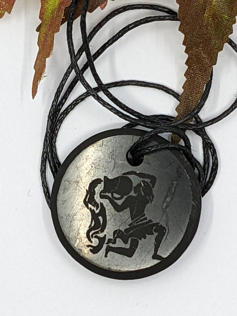 Shungite Aquarius zodiac sign pendant necklace on a white background, for intuition and balance.