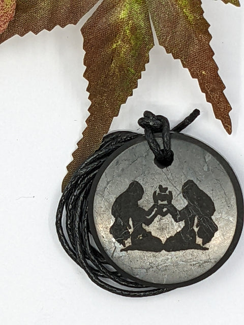 Shungite Gemini zodiac sign pendant necklace on a white background, for adaptability and clarity.