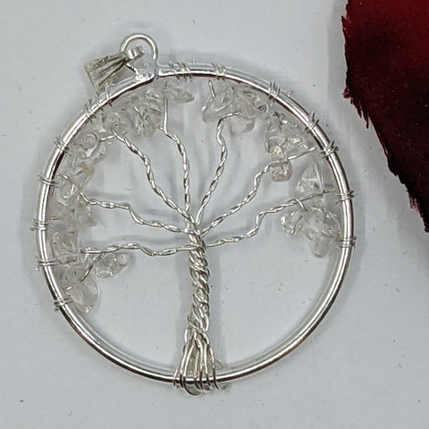Tree of Life Clear Quartz Chip Pendant with quartz chips in a Tree of Life frame on a white background.