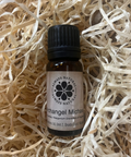 Bottle of 'Always Natural' Archangel Michael oil on a bed of straw.