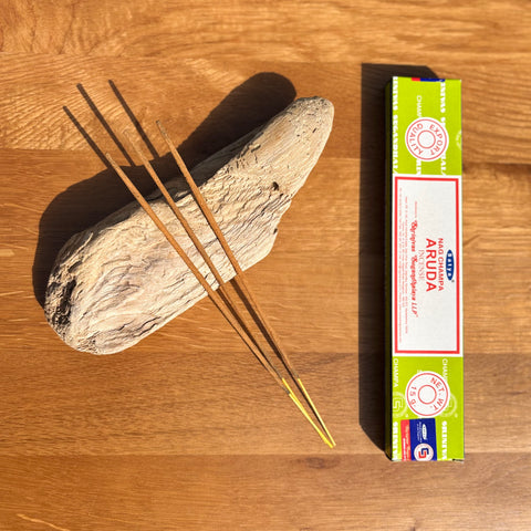 Satya Aruda Incense Sticks 15g box on a wooden background, crafted for purification and energy clearing.