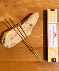 Satya Californian White Sage Nag Champa Incense Sticks 15g box on a wooden background, perfect for energy cleansing.