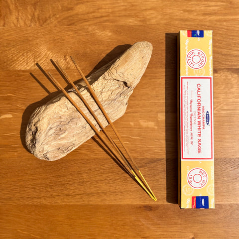 Satya Californian White Sage Nag Champa Incense Sticks 15g box on a wooden background, perfect for energy cleansing.
