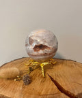 Citrine Quartz Agate Sphere – a polished crystal sphere combining citrine, quartz, and agate, with natural earthy tones, known for positivity, clarity, grounding, and balance.