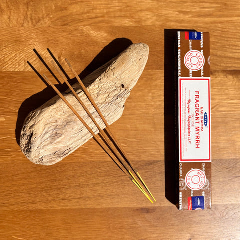 Satya Fragrant Myrrh Nag Champa Incense Sticks 15g box on a wooden background, featuring a rich purifying aroma.