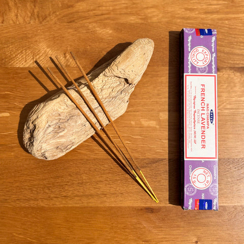 Satya French Lavender Nag Champa Incense Sticks 15g box on a wooden background, with a calming and relaxing fragrance.