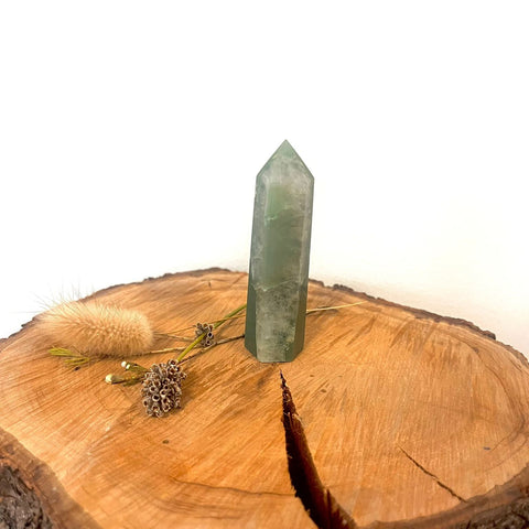 Green Aventurine Tower – a polished aventurine tower with soft green tones, known for prosperity, emotional calm, renewal, and growth.