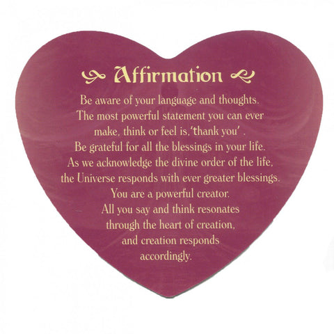 Heart-shaped card with an affirmation message promoting gratitude, positive thinking, and the power of creation, written in gold text.