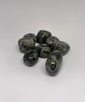 Kambaba Jasper Tumbled Stones displaying smooth, polished crystals with swirling green and black patterns, known for their grounding properties and ability to promote relaxation, inner peace, and emotional healing.