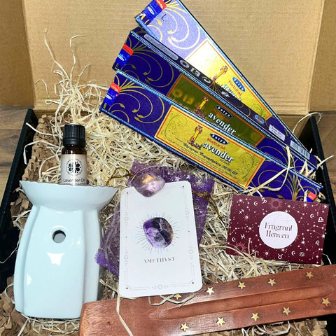 Gift box with lavender incense sticks, amethys stone, lavender oil, oil burner and incense stick holder.