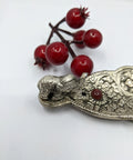 Closeup of Elephant Incense Burner with a metal finish and gem detailing, designed for securely holding incense sticks.