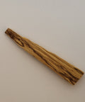 Sustainably sourced 4–6 inch Palo Santo stick on a white background, used for energy clearing and spiritual rituals.