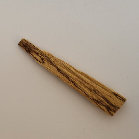 Sustainably sourced 4–6 inch Palo Santo stick on a white background, used for energy clearing and spiritual rituals.