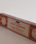 Satya Dark Cinnamon Incense Sticks 15g box on a white background, offering a rich and comforting fragrance.