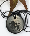 Shungite Leo zodiac sign pendant necklace on a white background, for vitality and confidence.