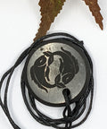 Shungite Pisces zodiac sign pendant necklace on a white background, for creativity and intuition.