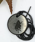 Shungite Virgo zodiac sign pendant necklace on a white background, for focus and precision.