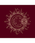 Intricate gold celestial design featuring a crescent moon, sun rays, and an all-seeing eye on a deep burgundy background.