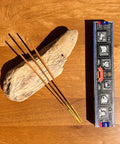 Satya Super Hit Incense Sticks 15g box on a wooden background, featuring a popular aroma for balance and meditation.