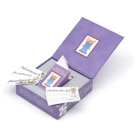 Open box of 'The Original Angel Cards' displaying cards with words like Authenticity, Abundance, and Acceptance, featuring colorful designs.