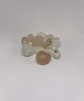 Topaz Tumbled Stones showcasing smooth, polished crystals in light shades of yellow, gold, and clear hues, ideal for clarity, healing, and enhancing personal strength.