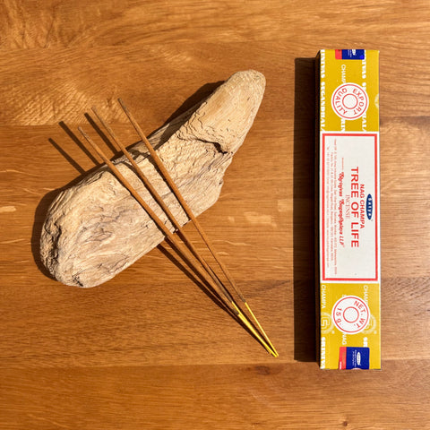 Satya Tree of Life Incense Sticks 15g box on a wooden background, with a grounding and harmonious fragrance.
