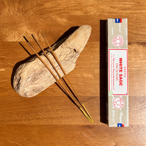 Satya White Sage Incense Sticks 15g box on a wooden background, used for energy cleansing and purification.