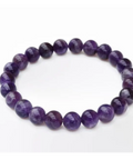 Polished round amethyst beads on stretch bracelet showing deep purple colour — Fragrant Heaven