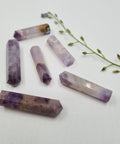 Amethyst crystal point with deep violet tones symbolising calm, clarity, and spiritual awareness. Associated with the Third Eye and Crown Chakras.