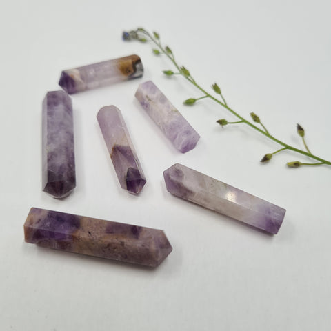 Amethyst crystal point with deep violet tones symbolising calm, clarity, and spiritual awareness. Associated with the Third Eye and Crown Chakras.