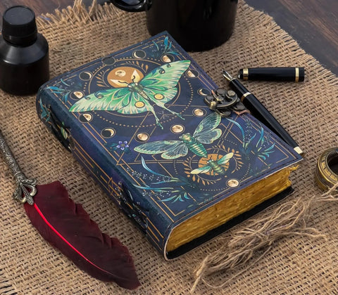 Butterfly leather journal vintage notebook styled with pen and writing accessories