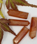 Carnelian crystal point with warm orange tones symbolising passion, motivation, and inner strength. Associated with the Sacral Chakra for creativity and confidence.