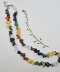 Chakra Balancing Crystal Chip Necklace with colorful gemstone chips on a white background.