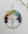 Tree of Life Chakra Chip Pendant with colorful gemstone chips in a Tree of Life design on a white background.