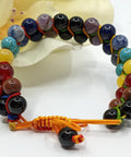 Chakra Super Powerball Bracelet with polished gemstone beads on a white background.