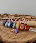 Chakra crystal wand with seven stones and clear quartz point for energy alignment and chakra balancing