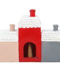 Rear view of Christmas Village Incense Cone Holder showing cone chamber opening.