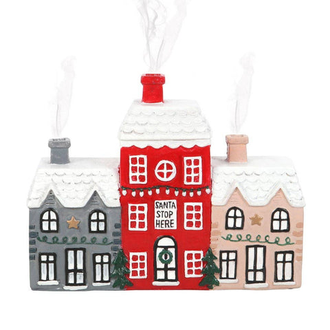 Christmas Village Incense Cone Holder with smoke rising from chimneys for a cosy effect.