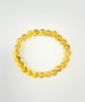 Citrine round bead stretch bracelet on white background showing warm golden yellow colour — Fragrant Heaven