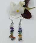 Chakra Balancing Crystal Chip Earrings featuring vibrant gemstone chips on a white background.