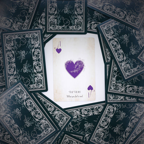 Spread of Fae Realm Oracle Playing Cards with intricate fairy-themed design and mystical symbols
