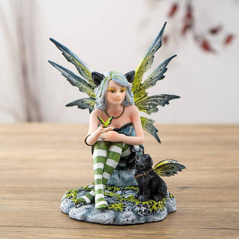 Fairy with Black Cat resin statue featuring a seated fairy with detailed wings and striped stockings, symbolizing magic, intuition, and companionship.