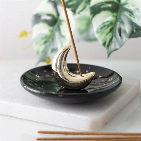 Moon Ceramic Incense Stick Holder displayed on a table with incense burning.
