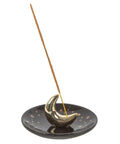 Gold Crescent Moon Ceramic Incense Holder with incense stick in place.