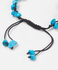 Fastener of Blue Howlite chip and turtle thread bracelet symbolising calm, protection, and wisdom. Adjustable cord design associated with the Throat Chakra.